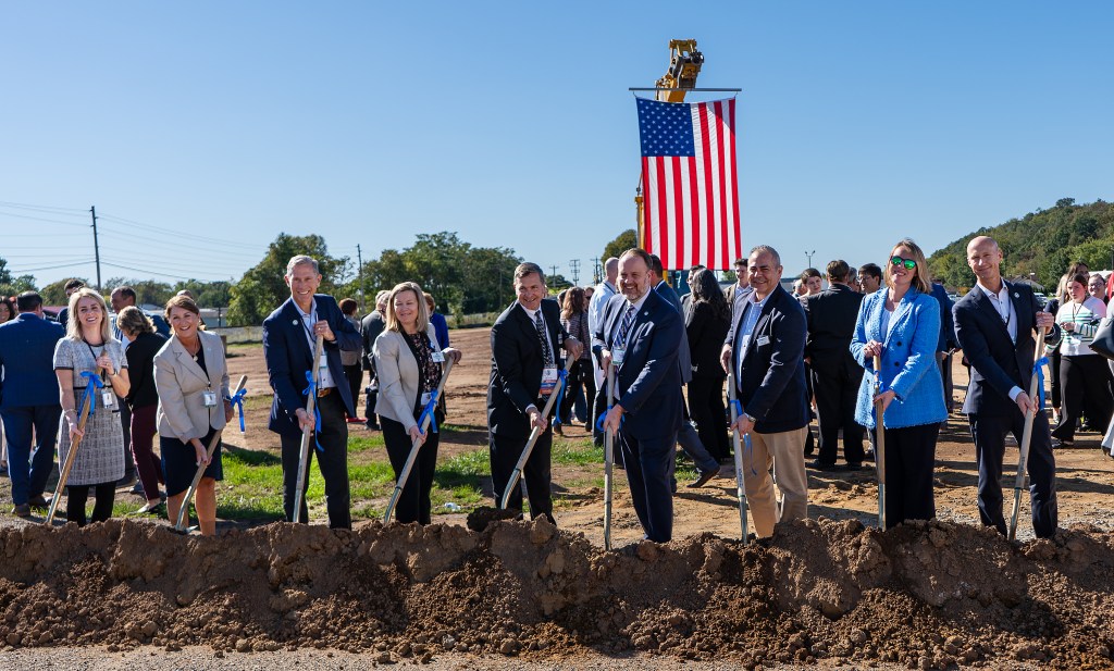 The Peoples Bank executive team hold shovels for the groundbreaking of the Women and Childrens' hospital in Belpre, Ohio.